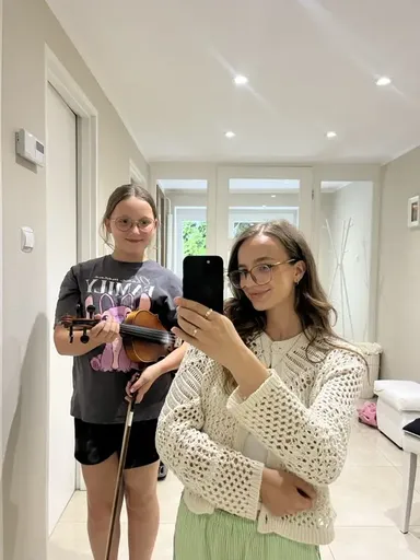 A student at a violin lesson in Kraków 8