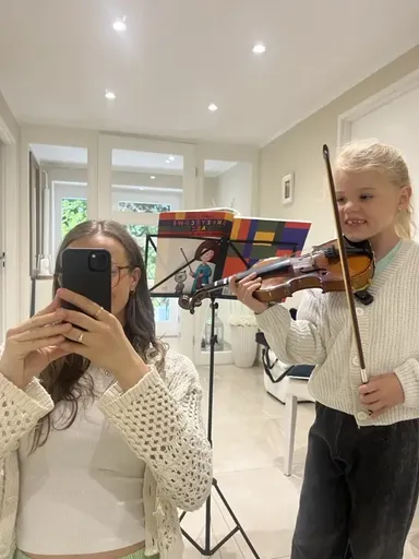 A student at a violin lesson in Kraków 15