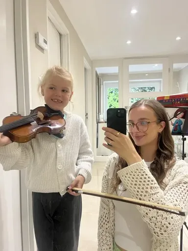 A student at a violin lesson in Kraków 16