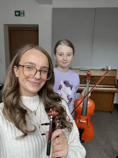 A student at a violin lesson in Kraków 18
