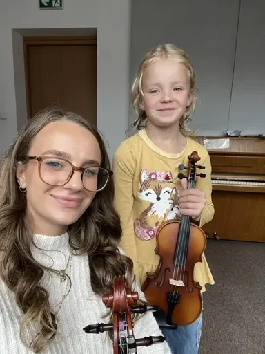 A student at a violin lesson in Kraków 19