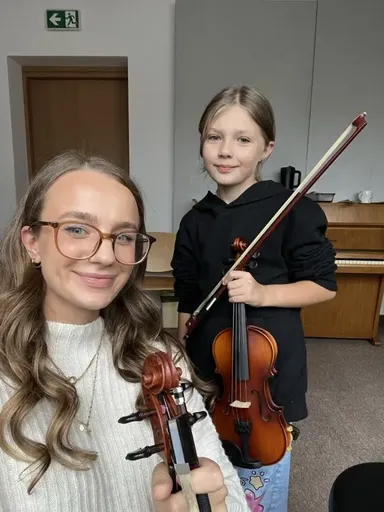 A student at a violin lesson in Kraków 21